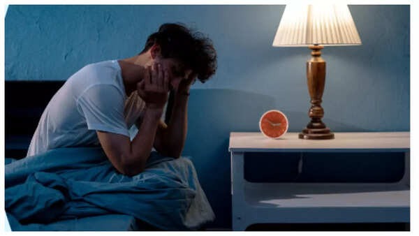 Sleepless woman in bed