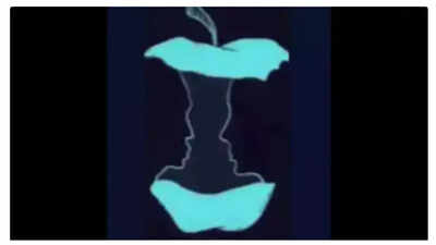 A mind-bending optical illusion featuring an apple and two faces.