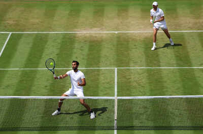 Yuki Bhambri playing a forehand at Wimbledon 2025